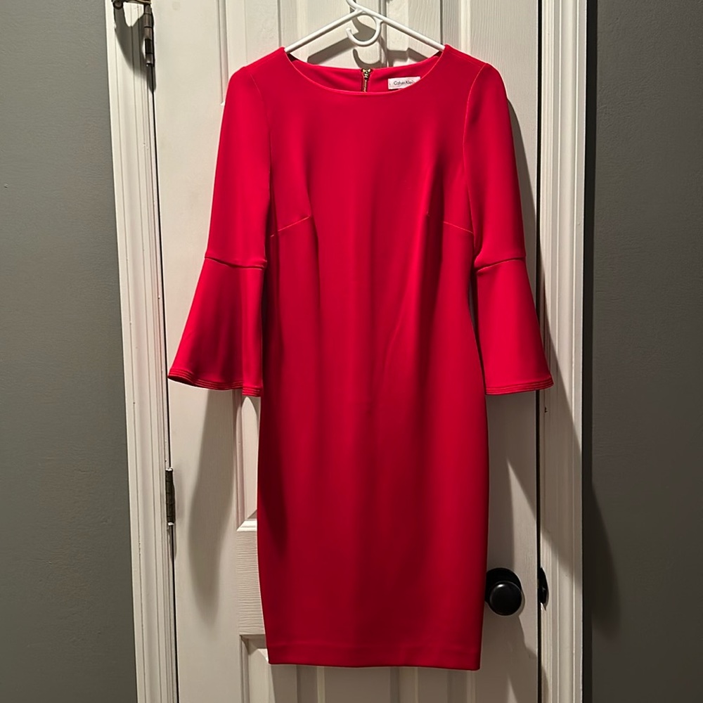 Comfortable and stylish dress—flared sleeves and eye catching back gold zipper.